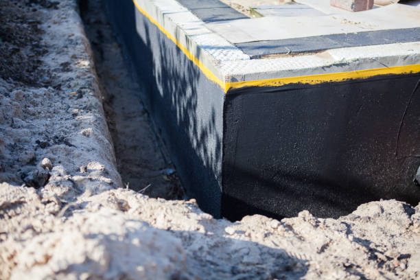Professional Emergency Waterproofing technician working in Carmel, IN